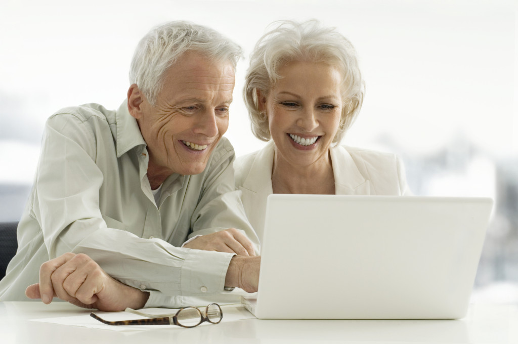 Older couple using a laptop together