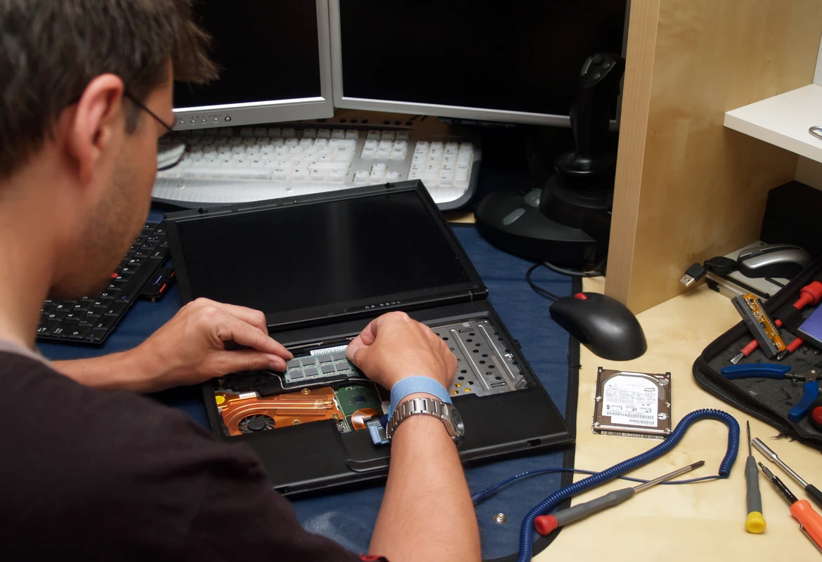 Laptop repair in Thetford by a local technician diagnosing a laptop